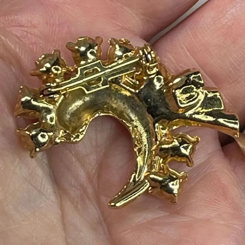 Vintage faux pearl crescent brooch with a small cluster tail accent.